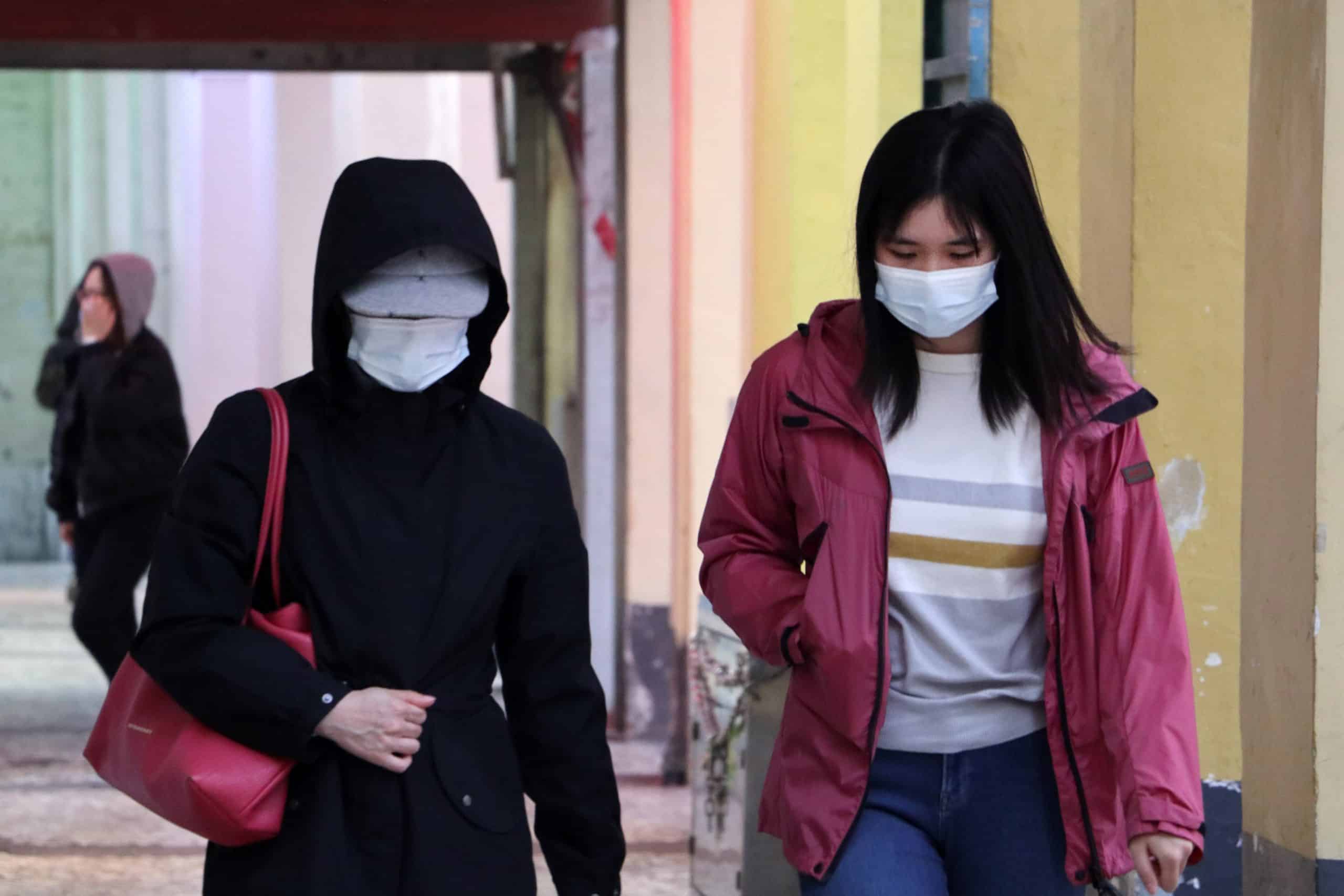 two women with face masks